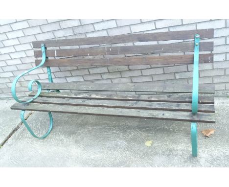 A slatted garden bench, with wrought iron supports, 165cm W.