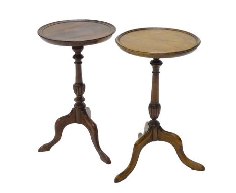 Two similar mahogany wine tables, each with a circular top, turned column and tripod base.