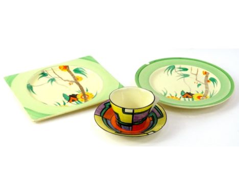 A Clarice Cliff Bizarre Tennis pattern tapering cup and saucer, with angular handle, saucer (AF), and two Wilkinson plates de