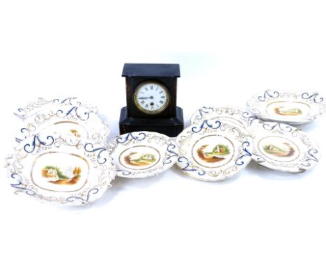 A Victorian polished slate mantel clock and various Victorian topographical dessert dishes.