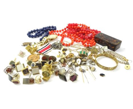 A quantity of modern costume jewellery and badges, to include cuff links, collar studs, faux pearl necklaces, filigree bangle