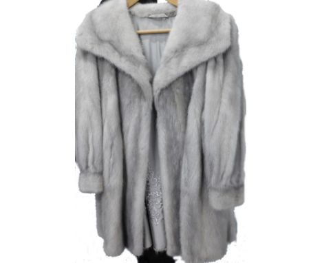 A ladies Noble mink grey fur coat, with decorative embroidered style lining.