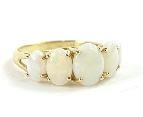 A five stone opal dress ring, with five oval cut opal stones, in claw setting, with pierced head, yellow metal, marked 14K, 2