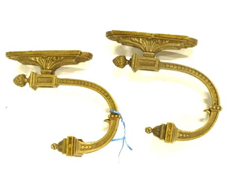A pair of French metal tie backs, each cast with a pineapple finial etc.