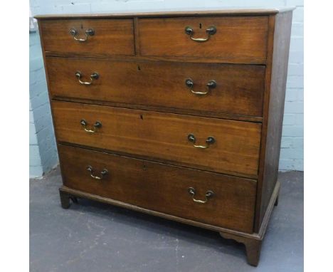 A 19thC oak chest of drawers, the top with a moulded edge above two short and three long drawers, each with brass drop handle