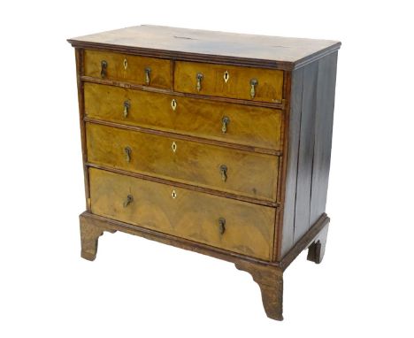 A mid 18thC walnut chest of drawers, the quarter veneered top with a crossbanded border, above two short and three long drawe