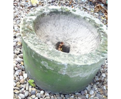 A circular stone hewn trough or sink, 39cm diameter.