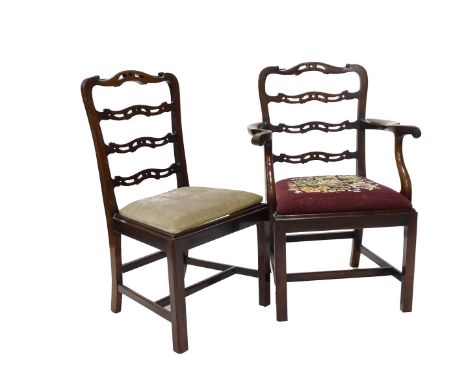 A mahogany open armchair, in George III style with pierced ladder back, shaped arms and a drop in seat with H stretcher and a