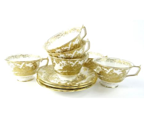 A Royal Crown Derby gold Aves pattern part tea service, comprising six cups and three saucers.