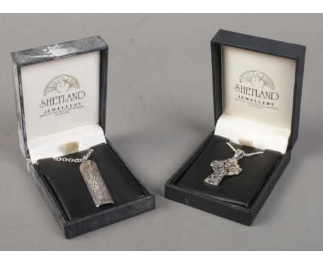 Two silver pendants on silver chains. Includes Shetland Celtic cross pendant and a Kevin Allen Jelling style example.  