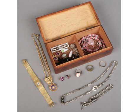 A wooden jewellery box and contents of jewellery. Includes ladies Rotary wristwatch, vintage examples, earrings, silver ring,