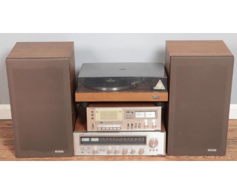 A Hitachi hifi stacking system. Includes stereo receiver, turntable, pair of speakers, etc.  