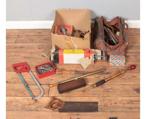 A box and a bag of tools. Includes Black &amp; Decker drill, garden sprayers, saws, etc.  
