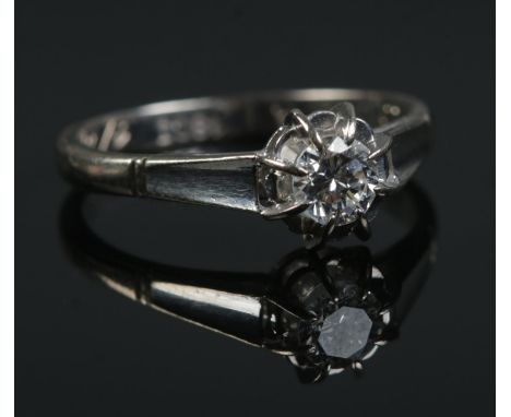 An 18ct white gold diamond solitaire ring. Size K 1/2. 2.92g.  Inscription to inside of shank.
