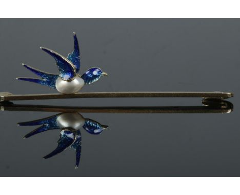 A 15ct gold bar brooch surmounted with a blister pearl and enamel bird. Length 5cm. 3.43g.  