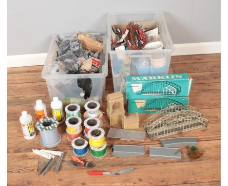Two boxes of assorted model railway spares and repairs to include Marklin Bridges, several rolls of wiring, wheel, card built