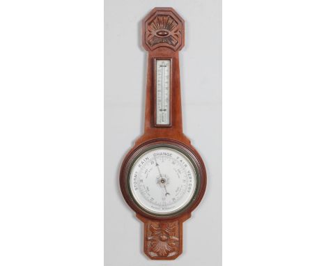 A carved mahogany Aneroid barometer.64cm  