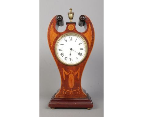 An Edwardian inlaid mahogany twin swan neck mantel clock. Having Roman numeral markers and French movement. Height 30cm.  