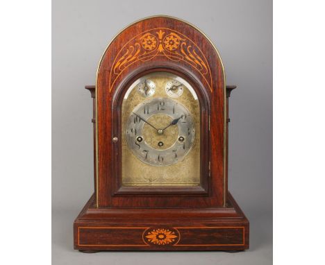 A Junghans inlaid mahogany bracket clock. Having brass dial and subsidiary dials for speed and chime. Height 44cm.  Some ligh