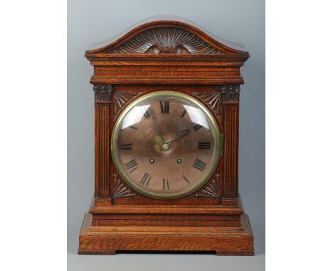 A carved oak cased Winterhalder &amp; Hofmeier bracket clock. Having Roman numeral markers and chiming on two coiled gongs. H