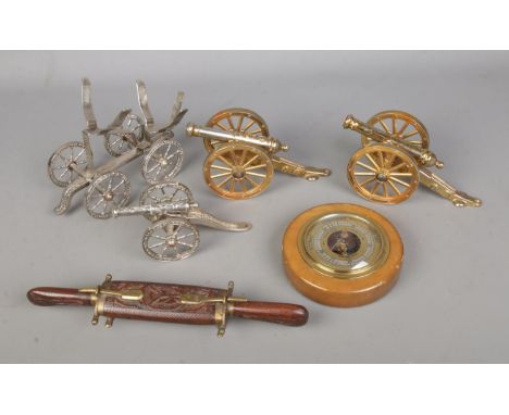 A quantity assorted collectables to include several brass desk canons, Guchard barometer and Indian carving set.  