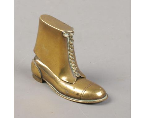 A brass novelty lighter in the form of a boot.  