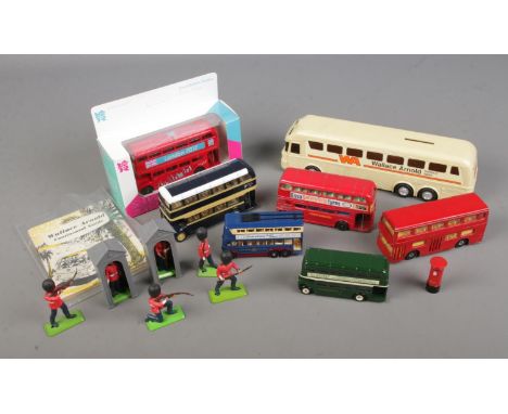 A collection of diecast busses including Dinky, Matchbox and Corgi examples together with Wallace Arnold &amp; Britain's toy 