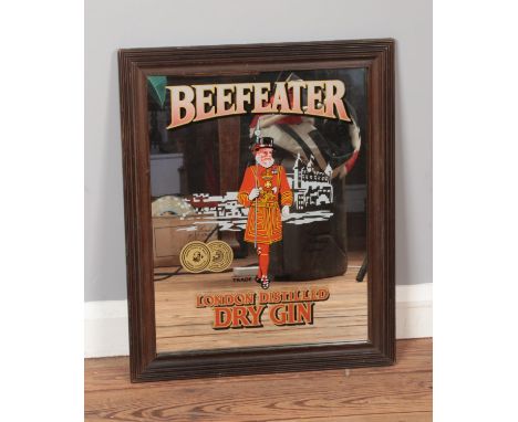 A vintage advertising mirror for Beefeater London Distilled Dry Gin. Approx. dimensions 45cm x 56cm.  