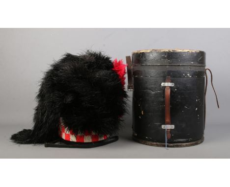 A Scottish four tail feather bonnet with thistle badge. In fitted box.  