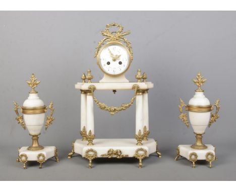 A French alabaster clock garniture with gilt metal mounts by Vincenti &amp; Cie, Paris. Height of clock 44cm.  Missing pendul