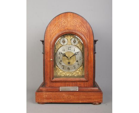 A Junghans inlaid mahogany bracket clock. Having brass dial and subsidiary dials for speed and chime. Bearing presentation pl
