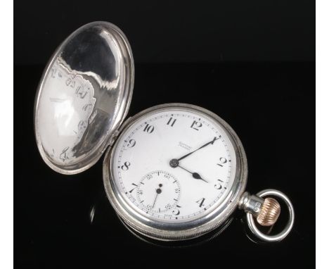 A silver cased full hunter pocket watch, having enamel dial with subsidiary seconds dial by Rattray Dundee.  