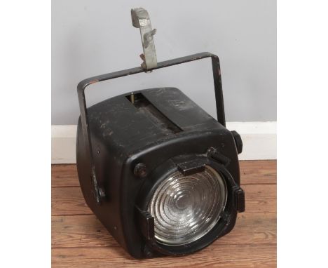 A vintage metal hanging stage light.  