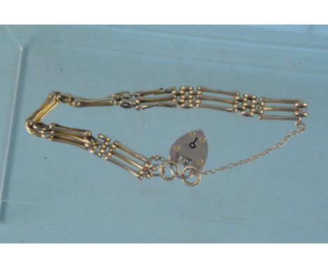 A yellow metal gate link bracelet with 9ct gold padlock clasp, weight approx 11g