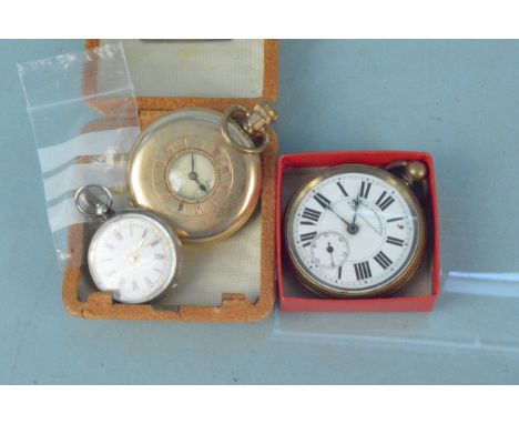 A Zenith gold plated half hunter pocket watch, a base metal cased railway timekeeper together with a ladies silver cased fob 