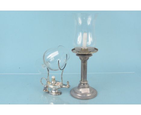 A silver plated brandy warmer in the form of Aladdins lamp plus a white metal lamp with glass