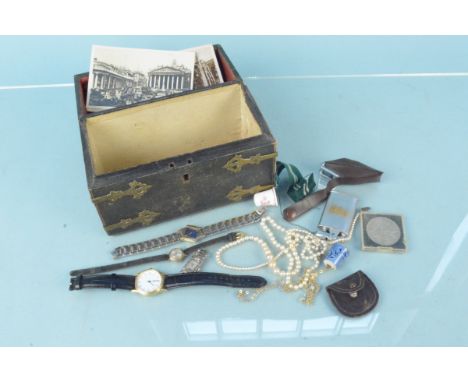 A leather clad chest form trinket box with contents including a 9ct gold ladies wristwatch, silver cased wristwatch, ephemera