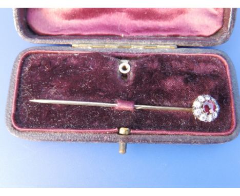 A garnet & diamond set cluster stick pin.