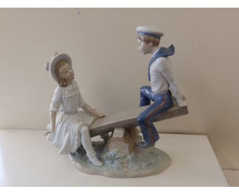 A Lladro figure group – see-saw.