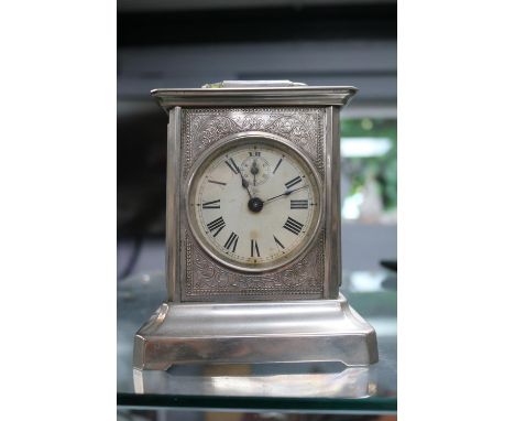 Wing Commander A E Temple 165005 RAF Junghans mantel clock with repousse case 15.5cm in height complete with Key 