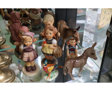 Collection of Hummel figures, Beswick Donkeys and a Hand painted figure of a Pheasant 