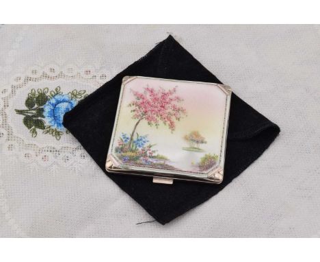 A George VI silver square powder compact, A George VI silver square powder compact, having guilloche enamel with tree in blos