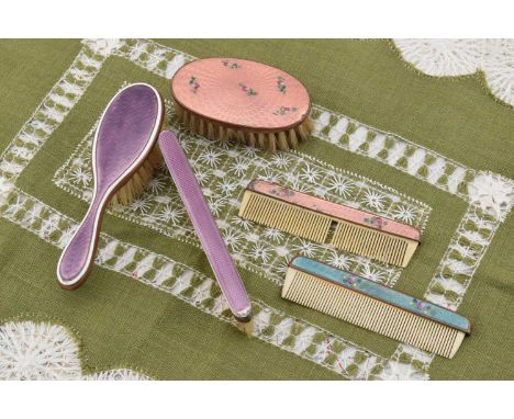 Guilloche enamel mounted children's brushes and combs, Guilloche enamel mounted children's brushes and combs, including oval 