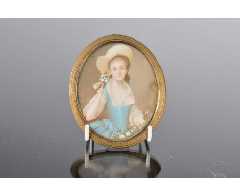 A late Georgian ivory portrait miniature, oval, 8.5cm by 7cm, depicting a lady in hat holding flowers, sold with Ivory Declar