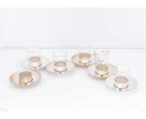 A set of six small Edwardian silver beaker holders, 7cm diameter, Birmingham 1906, together with a set of five small liquor b