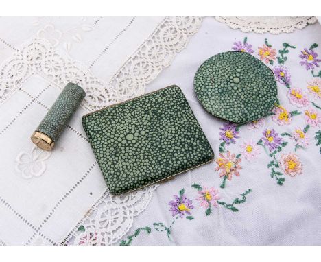 A circular shagreen effect enamel mirror, A circular shagreen effect enamel mirror, 7cm diameter together with similar rectan