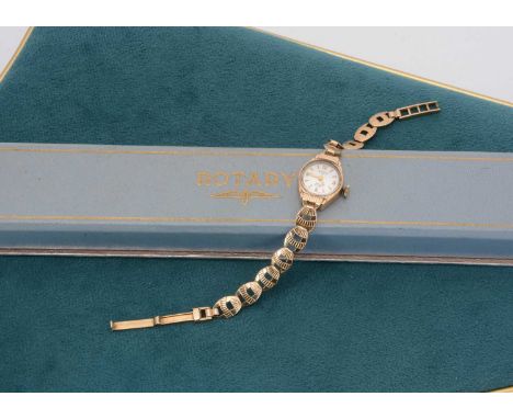 A ladies Rotary 9ct gold wrist watch, 17.5 cm long, 7.9g gold weight in a blue retailer box