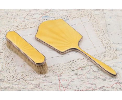 A George V silver dressing table mirror and clothes brush having yellow guilloche enamel decoration, A George V silver dressi