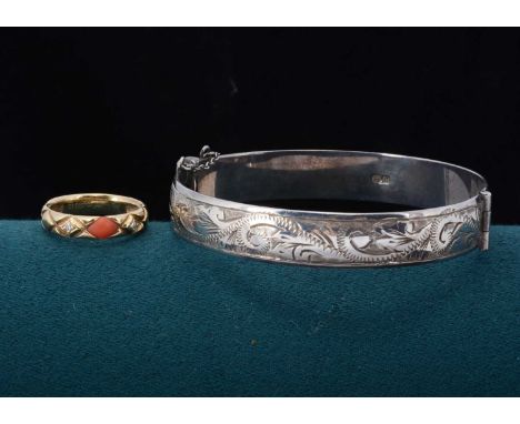 A continental 14k diamond and coral dress ring, ring size K, 3.7g together with a silver bangle, 5.4cm x 5.8cm, 25g (2)