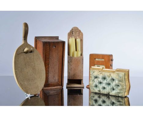 Five Victorian and 20th century wooden items, including a Mouseman style bread board paddle, cracked, an Art Deco desk perpet